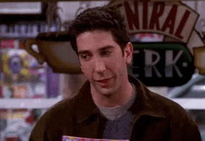 GIF of Ross from the show Friends patting himself on the back